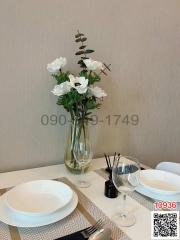 Elegantly set dining table with floral centerpiece