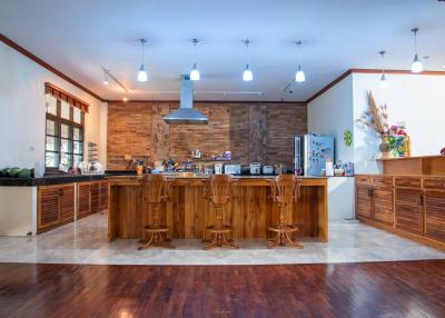 Spacious modern kitchen with central island and wooden cabinets