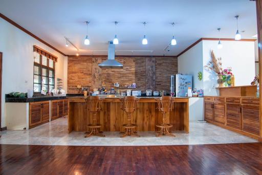 Spacious modern kitchen with central island and wooden cabinets