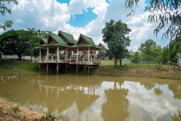 Traditional stilt house by the river surrounded by nature