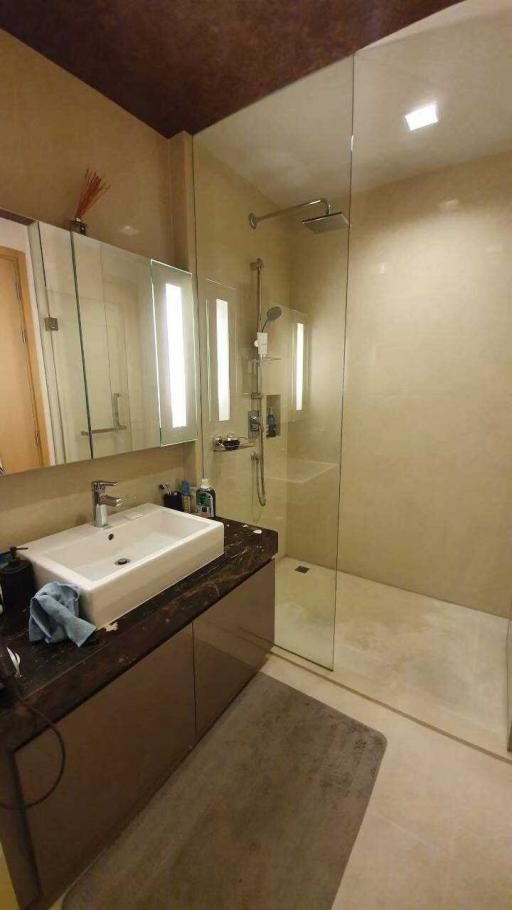 Modern bathroom interior with glass shower and vanity