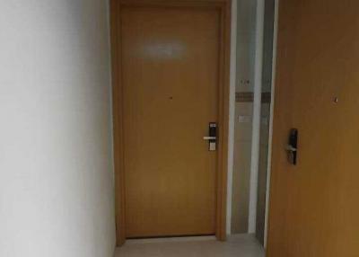 Interior hallway with tiled floor and wooden doors