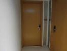 Interior hallway with tiled floor and wooden doors