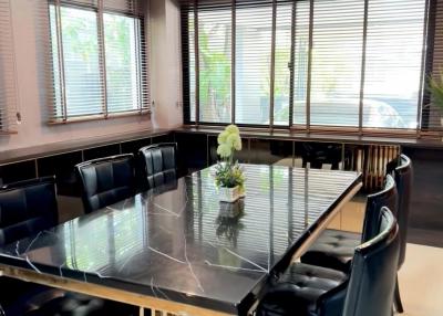 Modern dining room with large table and comfortable chairs