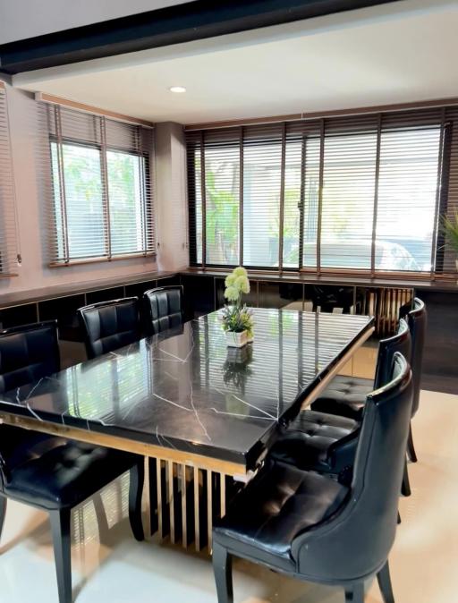 Modern dining room with large table and comfortable chairs