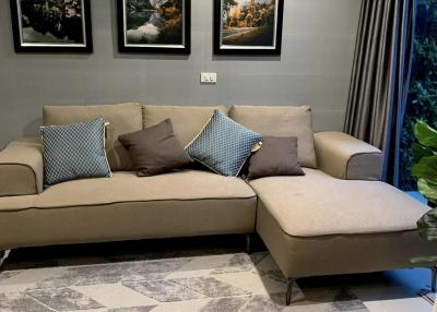 Cozy living room with sectional sofa and wall art