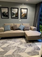 Cozy living room with sectional sofa and wall art