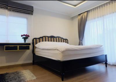 Elegantly designed bedroom with natural light