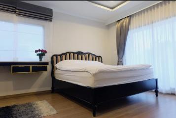 Elegantly designed bedroom with natural light