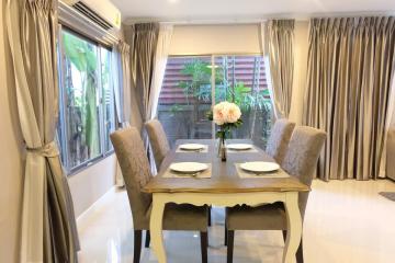 Elegant dining room with natural light and modern furniture