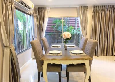 Elegant dining room with natural light and modern furniture