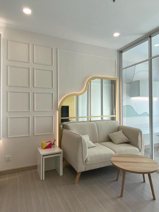 Modern living room with elegant decor and plenty of natural light