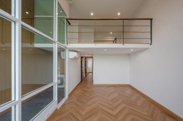 Spacious modern building interior with mezzanine and large windows