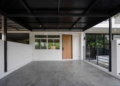 Spacious and clean garage with a tiled floor and ample lighting