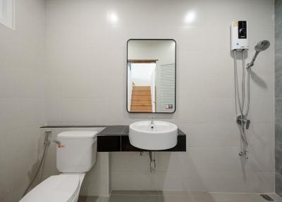 Modern bathroom with white tiles and essential fittings