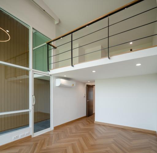 Spacious and modern living area with mezzanine and large windows