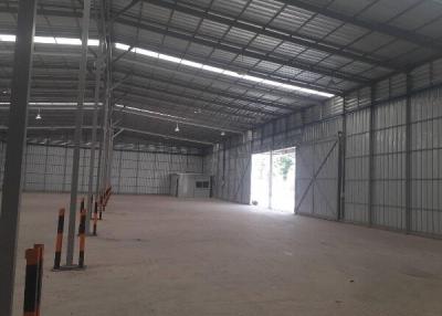 Spacious industrial warehouse interior with metal structure