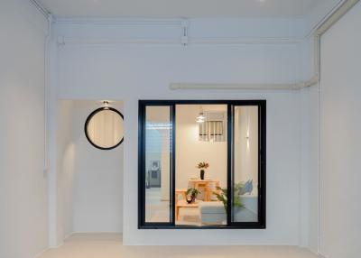 Modern interior view of a well-lit room through a large window