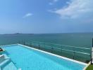 Infinity pool with ocean view and clear skies