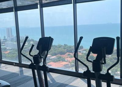 High-rise gym with panoramic sea views and cardio equipment