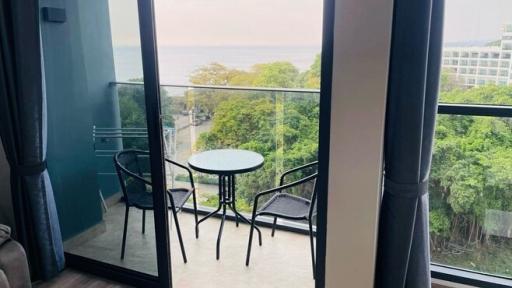 Cozy balcony with a sea view, chairs and a table