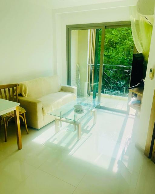 Bright and airy living room with balcony access