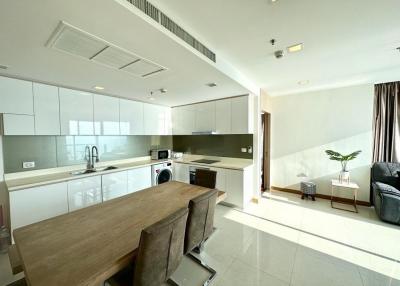 Modern open-plan kitchen and living space with ample natural light
