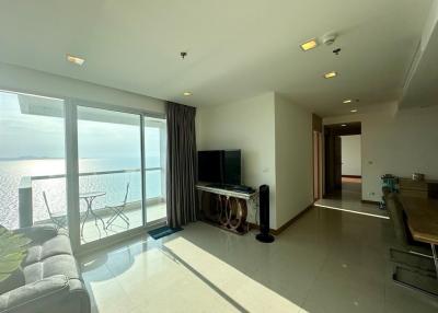 Spacious living room with natural light and sea view