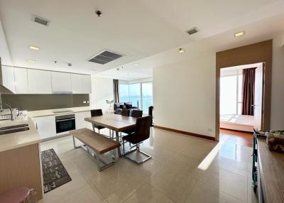 Spacious kitchen with modern appliances and adjoining dining space with large windows