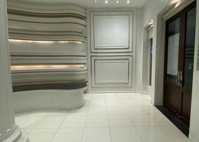 Elegant modern hallway with decorative wall panels and recessed lighting