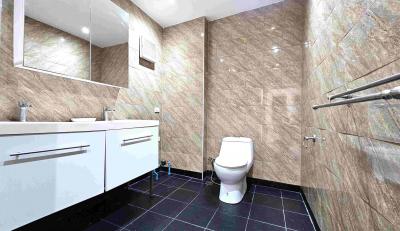 Modern bathroom with double vanity and tiled walls