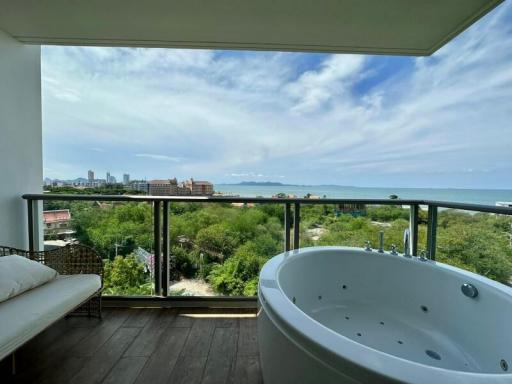 Spacious balcony with a whirlpool tub and a panoramic sea view