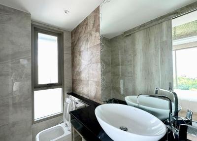 Modern bathroom with double sink and large window