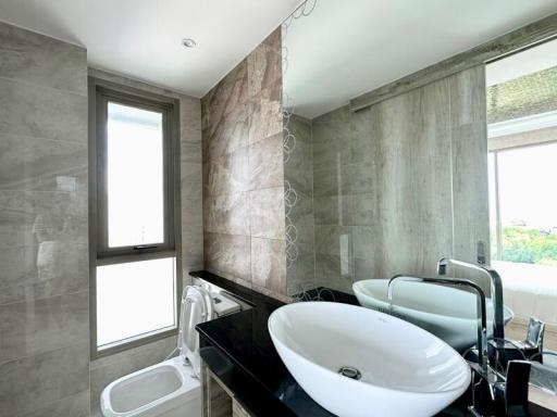 Modern bathroom with double sink and large window