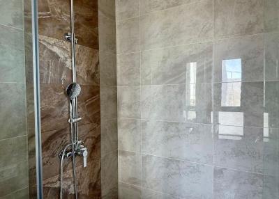 Modern bathroom with tiled shower area