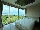 Spacious bedroom with a scenic view and natural lighting