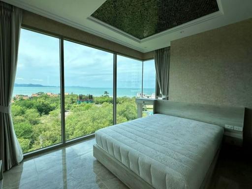 Spacious bedroom with a scenic view and natural lighting