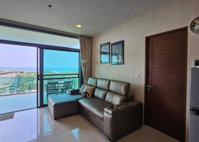 Modern living room with ocean view and balcony access