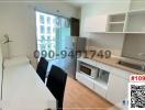 Modern compact kitchen with white cabinetry and dining area