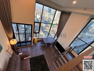 Modern living room interior with large windows and city view