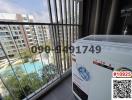 Modern balcony overlooking the pool with an outdoor washing machine