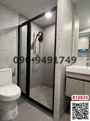 Modern bathroom with glass shower and well-lit vanity area