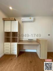 Bright and clean bedroom with built-in workspace and air conditioning unit