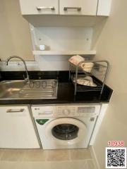 Compact kitchen space with built-in appliances and modern finishes