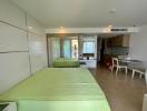 Bright modern studio bedroom with integrated kitchen and mirrored wardrobe