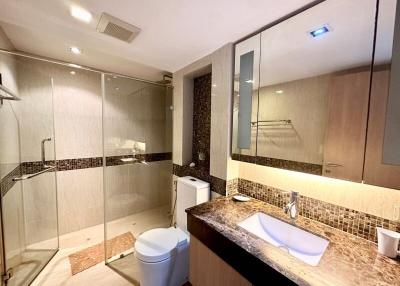 Modern bathroom interior with glass shower and vanity