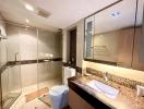 Modern bathroom interior with glass shower and vanity