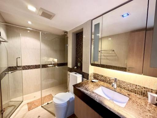 Modern bathroom interior with glass shower and vanity