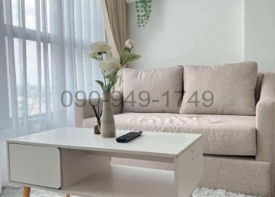 Modern living room with beige sofa and stylish coffee table