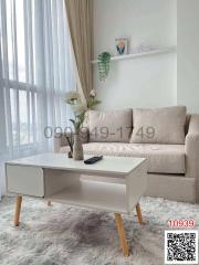 Modern living room with beige sofa and stylish coffee table